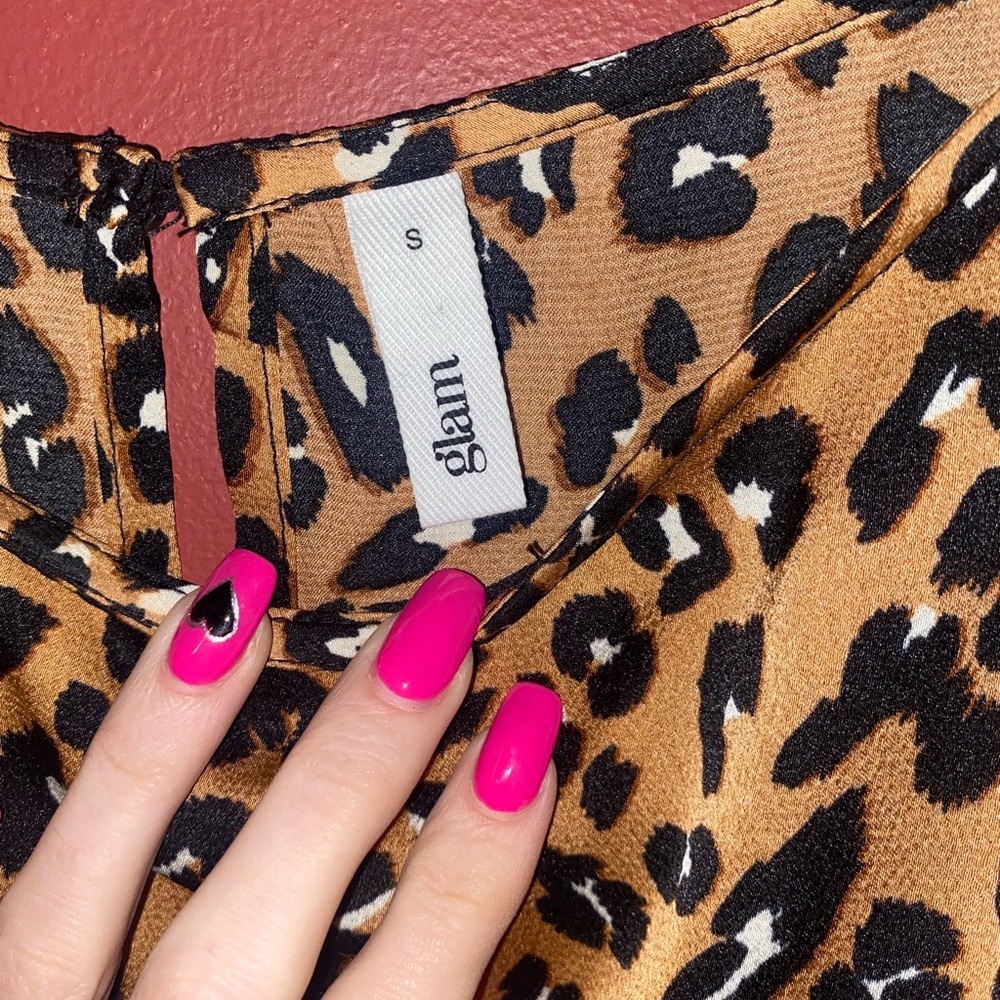 Brand Glam cheetah print short dress that has a tie with tassels.